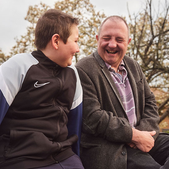 Image showing a man and young boy smiling